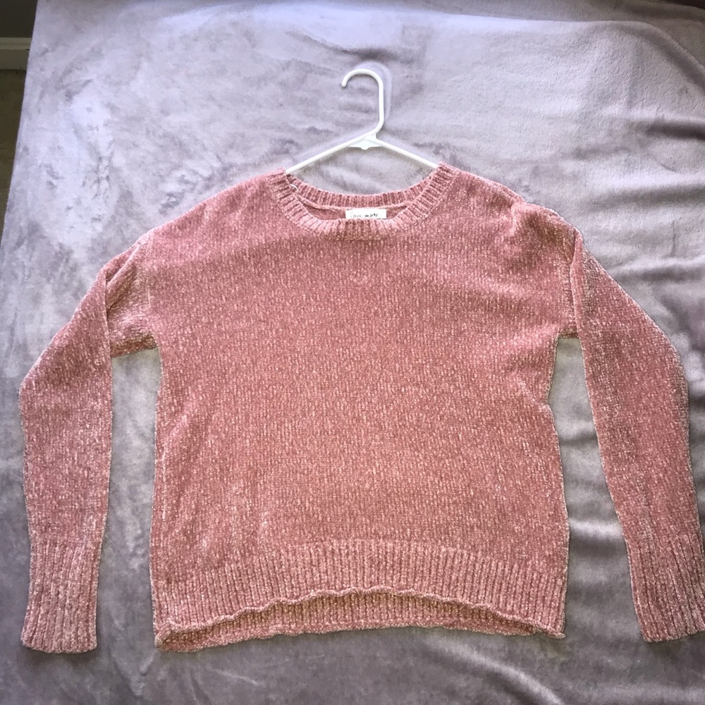 A pink sweater
